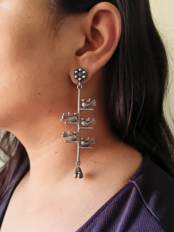 silver look-alike bird dangler earrings