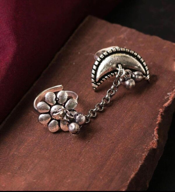oxidised adjustable dual ring attached with a silver chain & designed with ghungroos in flower & moon pattern.